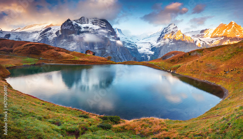 panoramic morning view of bachalp lake bachalpsee switzerland majestic autumn scene of swiss alps grindelwald bernese oberland europe beauty of nature concept background photo