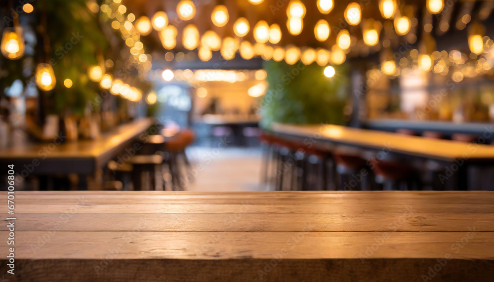 empty wooden table and blurred background of hall of stage bar or cafe with bokeh lights high quality photo