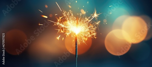 A close-up of a Bengal light on a urban blurred background. Celebration of the new year and Christmas. Party accessory