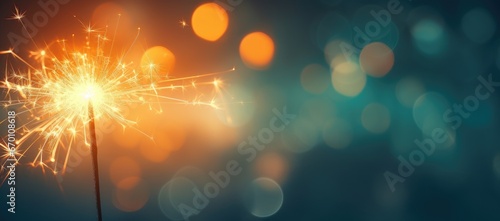 A close-up of a Bengal light on a urban blurred background. Celebration of the new year and Christmas. Party accessory © masyastadnikova
