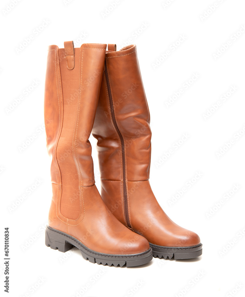 New high brown boots on a white background.