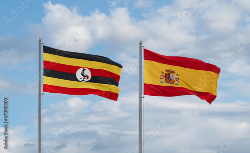 Spain and Uganda flags, country relationship concept