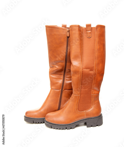 New high brown boots on a white background.