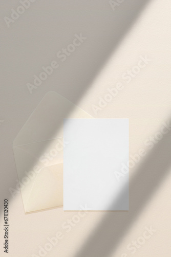 Wedding stationery invitation card mockup 5x7 and beige envelope on neutral beige background, bridal shower mockup. Minimal blank card mockup, thank you card, greeting card