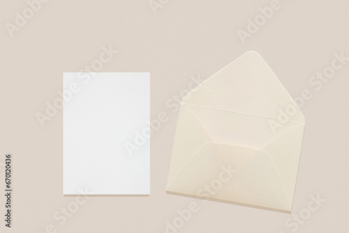 Wedding stationery invitation card mockup 5x7 and beige envelope on neutral beige background, bridal shower mockup. Minimal blank card mockup, thank you card, greeting card