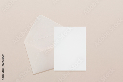 Wedding stationery invitation card mockup 5x7 and beige envelope on neutral beige background, bridal shower mockup. Minimal blank card mockup, thank you card, greeting card
