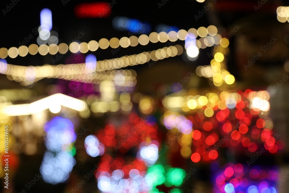 Obraz na płótnie Blurry Christmas lights by night w salonie