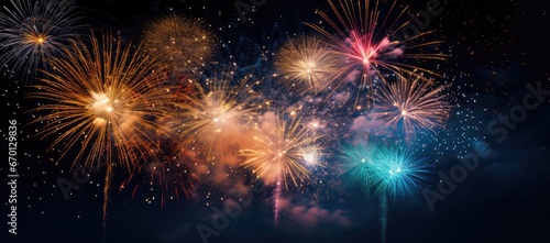 Multicolored fireworks on a dark background. Banner for the site. Place for text. Wallpaper for holidays. Festive light