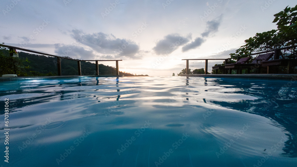 View of the mountains, sunset from a swimming pool View of the mountains, sunset from a swimming pool