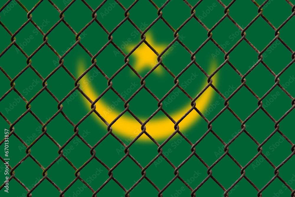 Fototapeta premium A steel mesh against the background of the flag Mauritania.