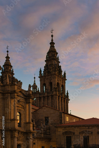 Close-up of the Cathedral of Santiago de Compostela, with its impressive architectural details illuminated by the warm evening light