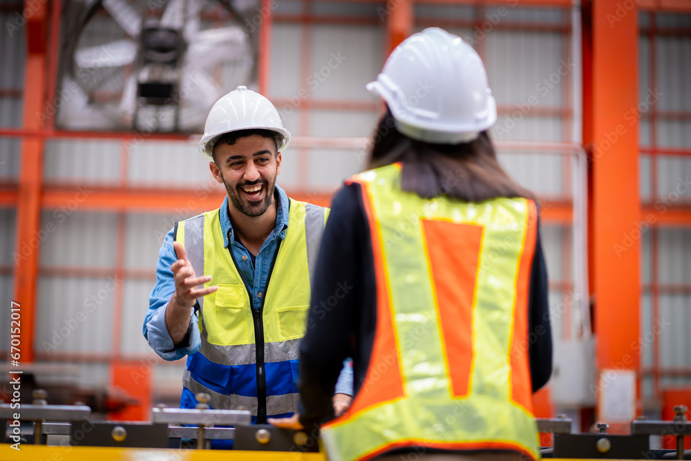 Young male engineer in metal sheet factory Responsible work is being inspected at the actual work site Young male engineer in metal sheet factory Responsible work is being inspected at the actual work site