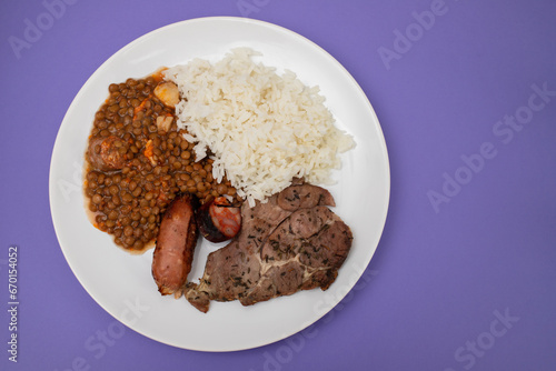 grilled meat  sausage  lentils and boiled rice