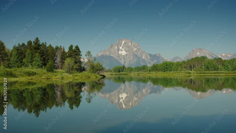 Reflection of mountain range in scenic Snake River / Grand Teton National Park, Wyoming, United States Reflection of mountain range in scenic Snake River / Grand Teton National Park, Wyoming, United States