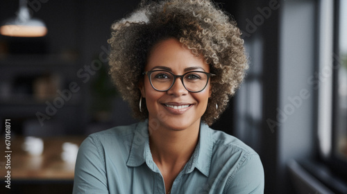 Portrait of a beautiful young african american business woman in glasses.
