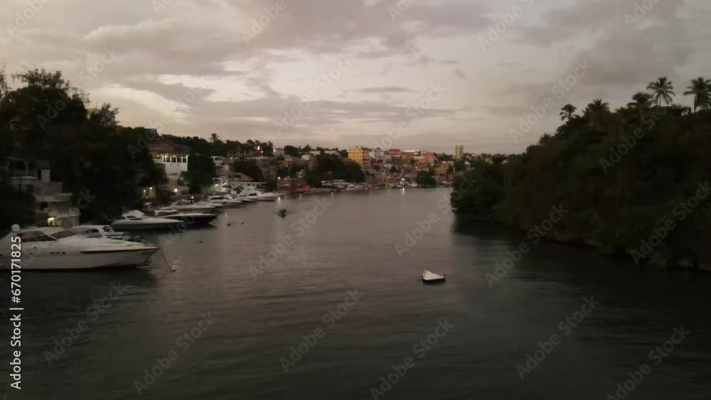 Aerial sunset view of city in golden hour almost falling night near bridge and pier Aerial sunset view of city in golden hour almost falling night near bridge and pier