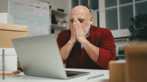 Man feeling upset, bad day at work, lost deal or client, small business owner
