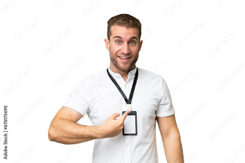 Young caucasian man with ID card isolated on green chroma background with surprise facial expression Young caucasian man with ID card isolated on green chroma background with surprise facial expression