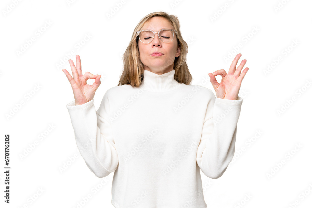 Young blonde woman over isolated background in zen pose Young blonde woman over isolated background in zen pose