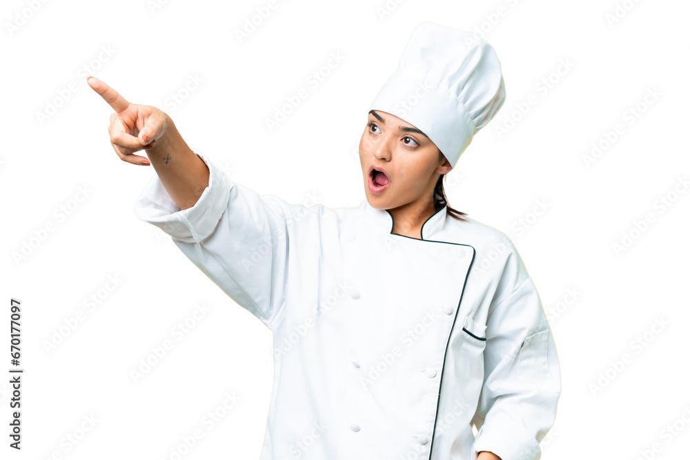 Young woman Chef over isolated chroma key background pointing away Young woman Chef over isolated chroma key background pointing away