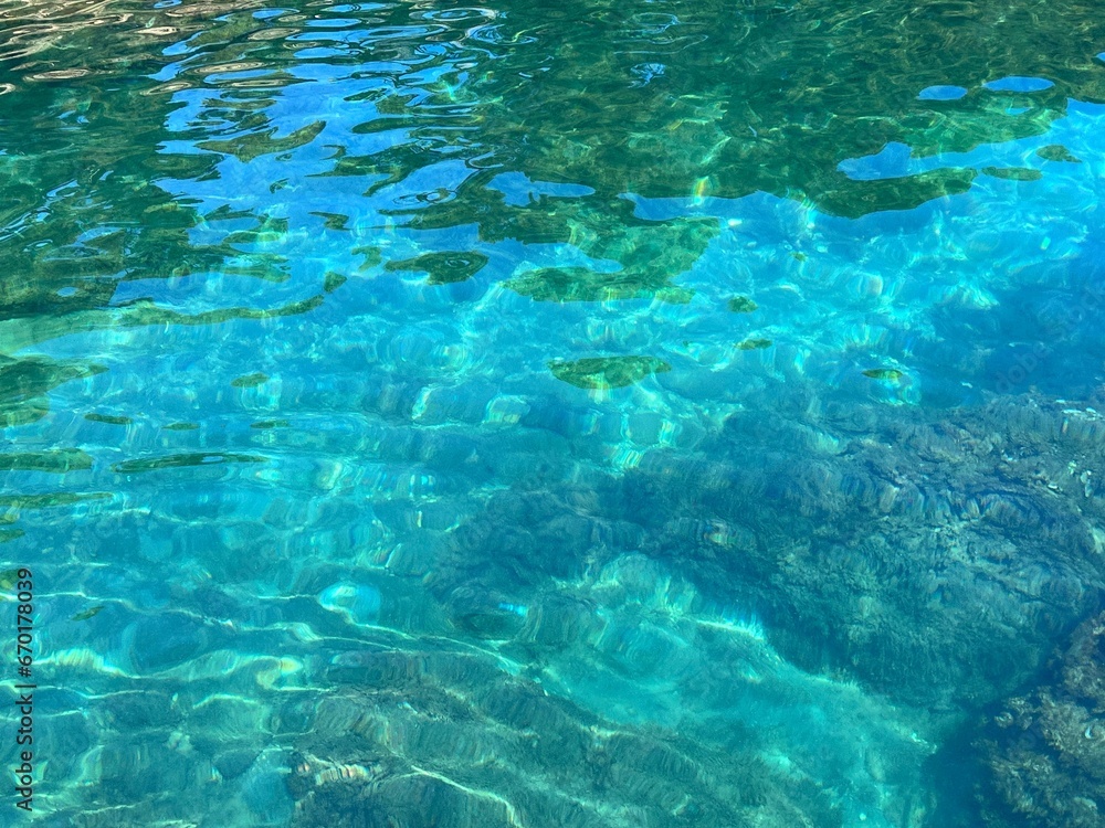 Perfectly clear sea water blue turquoise surface.