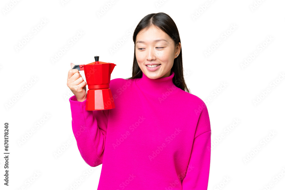 Young Asian woman holding coffee pot over isolated chroma key background with happy expression Young Asian woman holding coffee pot over isolated chroma key background with happy expression