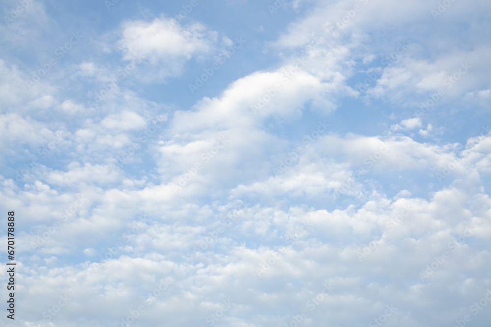 Blue sky with white light clouds. Cloud texture, background. Blue sky with white light clouds. Cloud texture, background.