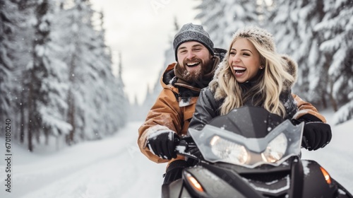 Portrait of happy couple riding on a snowmobile in the snowy forest photo