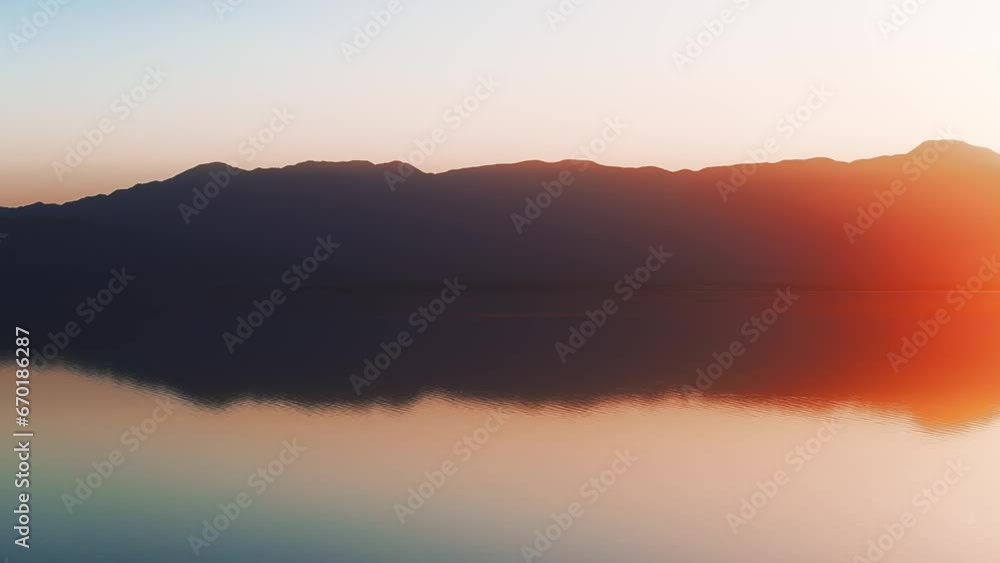 Aerial view of sunset horizon over the sea. Cinematic drone aerial view beautiful evening sunset in sky over the sea. Sun path is reflected in sea surface. Nature beauty. Aerial view of sunset horizon over the sea. Cinematic drone aerial view beautiful evening sunset in sky over the sea. Sun path is reflected in sea surface. Nature beauty.