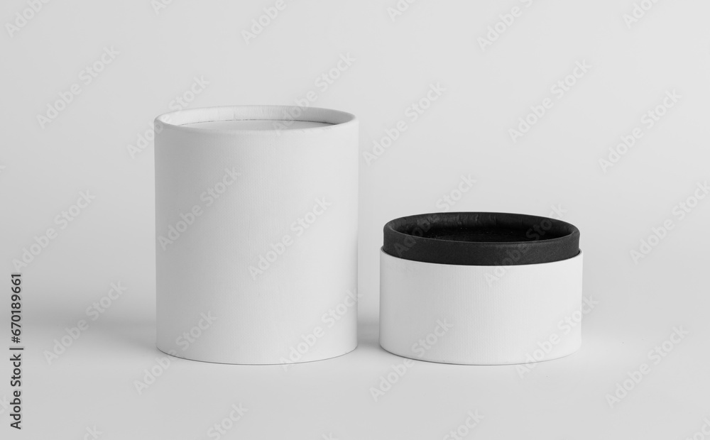 White paper covered box. Cylinder shaped perfume box. Box mockup design. White paper covered box. Cylinder shaped perfume box. Box mockup design.