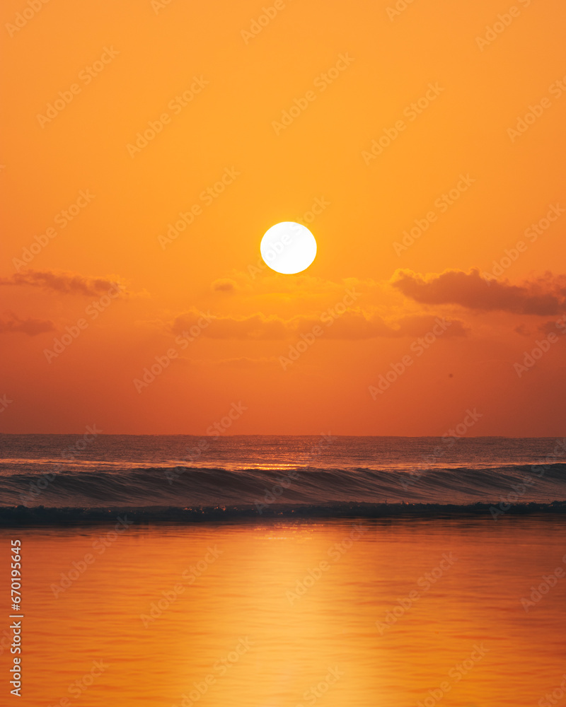 Morning golden sunrise background with the ocean waves from the beautiful coast of puerto rico playa aviones loiza beach 