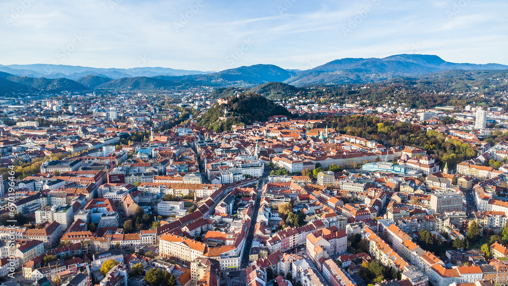 Aerial view of the city of Graz with the city centre and the landmark Schloßberg in the background