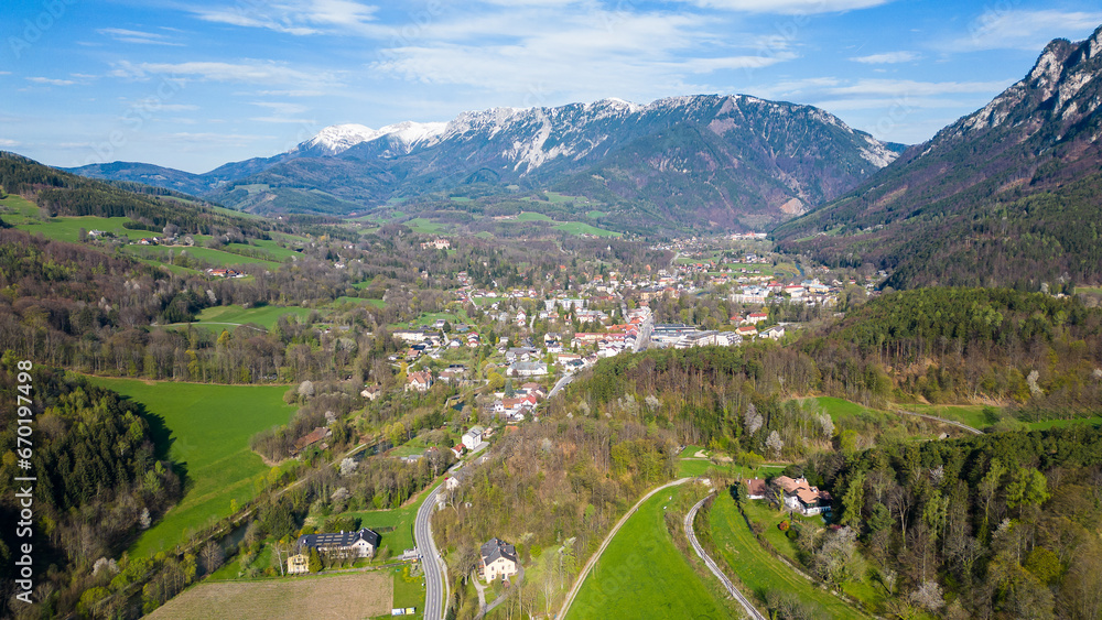 Aerial view of beautiful rural village Reichenau in Austria with the mountain Rax in the background