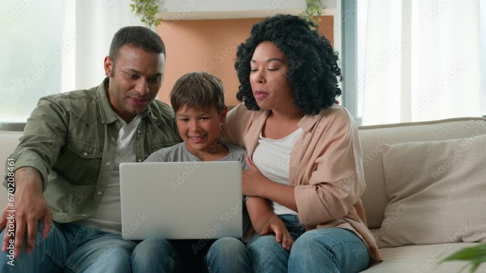 Multiracial family African American parents and Caucasian little boy son child talking use computer webcam video call happy mom dad teen kid communicate remote chatting online on laptop device at home Multiracial family African American parents and Caucasian little boy son child talking use computer webcam video call happy mom dad teen kid communicate remote chatting online on laptop device at home
