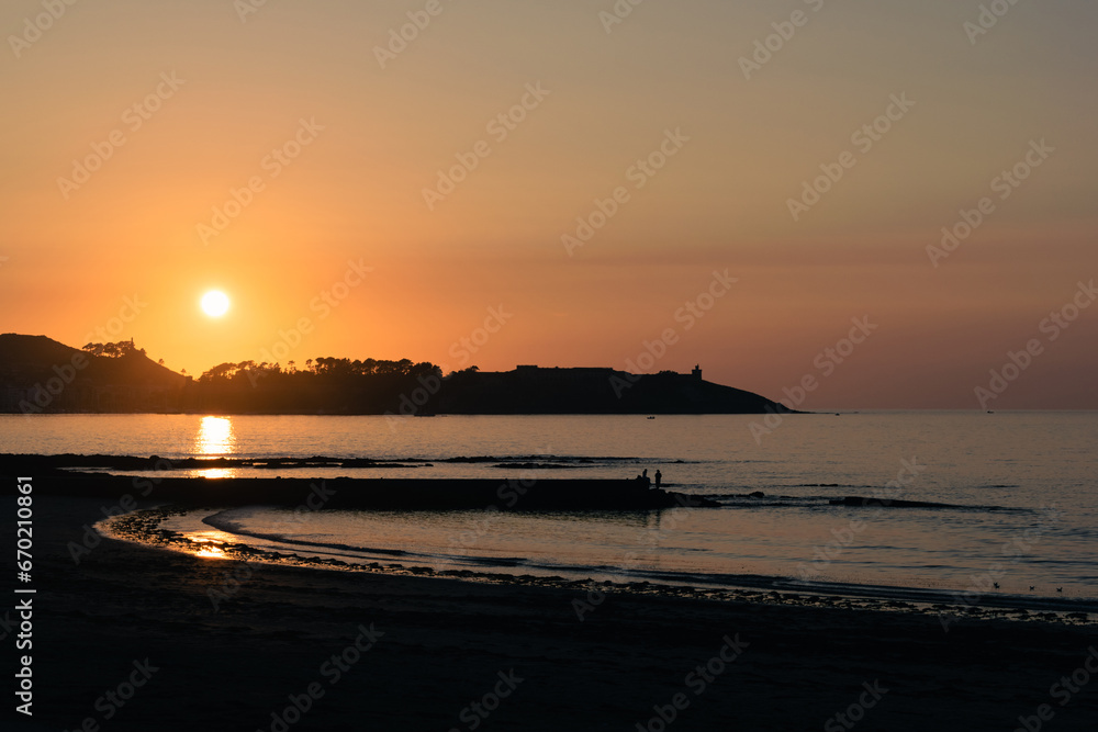 Beautiful image of the sunset at the Playa América breakwater in Nigran. Galicia - Spain
