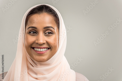 Arabian beautiful woman wearing traditional middle-eastern abaya portrait on isolated background photo