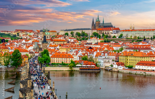 Prague cityscape with Charles Bridge over Vltava river and Hradcany castle at sunset, Czech Republic