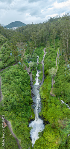 Aerial view of picturesque waterfall in the forests of Ecuador on the outskirts of the city of Otavalo.