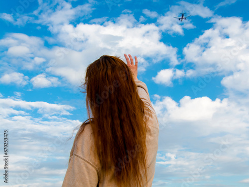 Young woman and an airplane