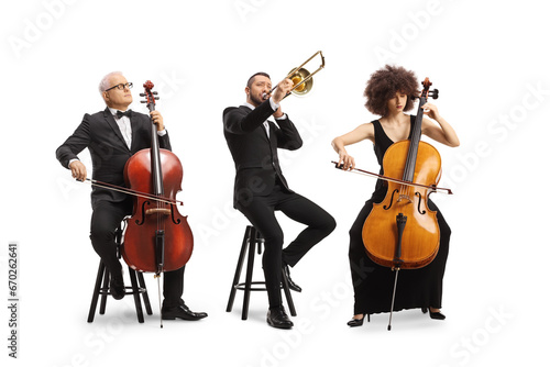 Full length portrait of musicians sitting and playing cellos and a trombone