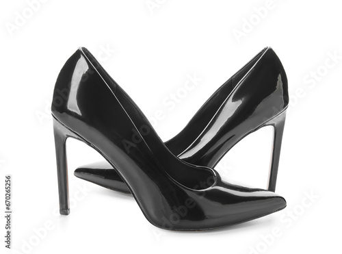 Stylish black high heels on white background