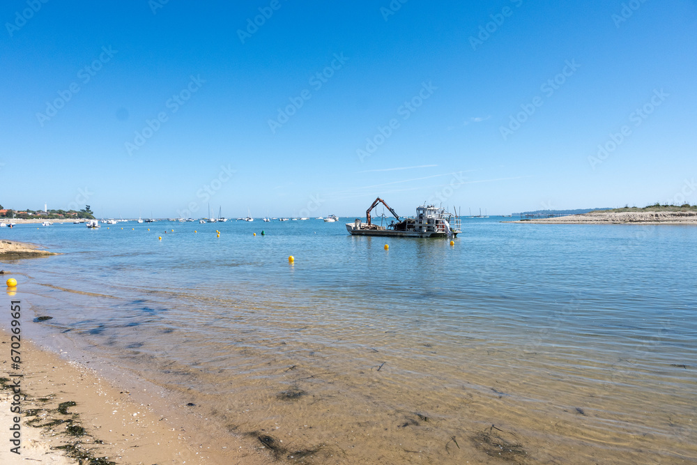 View on Arcachon Bay with many fisherman's boats and oysters farms near Le Phare du Cap Ferret, Cap Ferret peninsula, France, southwest of Bordeaux, France's Atlantic coastline View on Arcachon Bay with many fisherman's boats and oysters farms near Le Phare du Cap Ferret, Cap Ferret peninsula, France, southwest of Bordeaux, France's Atlantic coastline