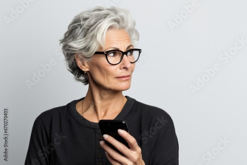 senior old woman doubtful, thinking or choosing concept photo