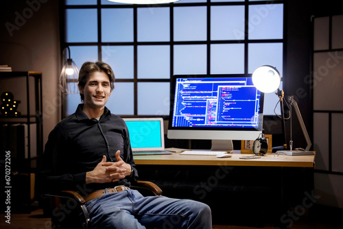 Happy young male programmer...