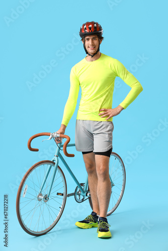 Young male cyclist with bic...
