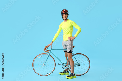 Young male cyclist with bic...