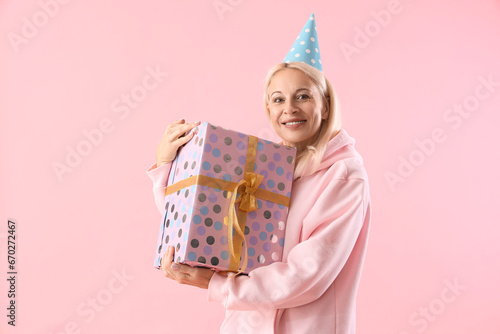 Happy mature woman in party...