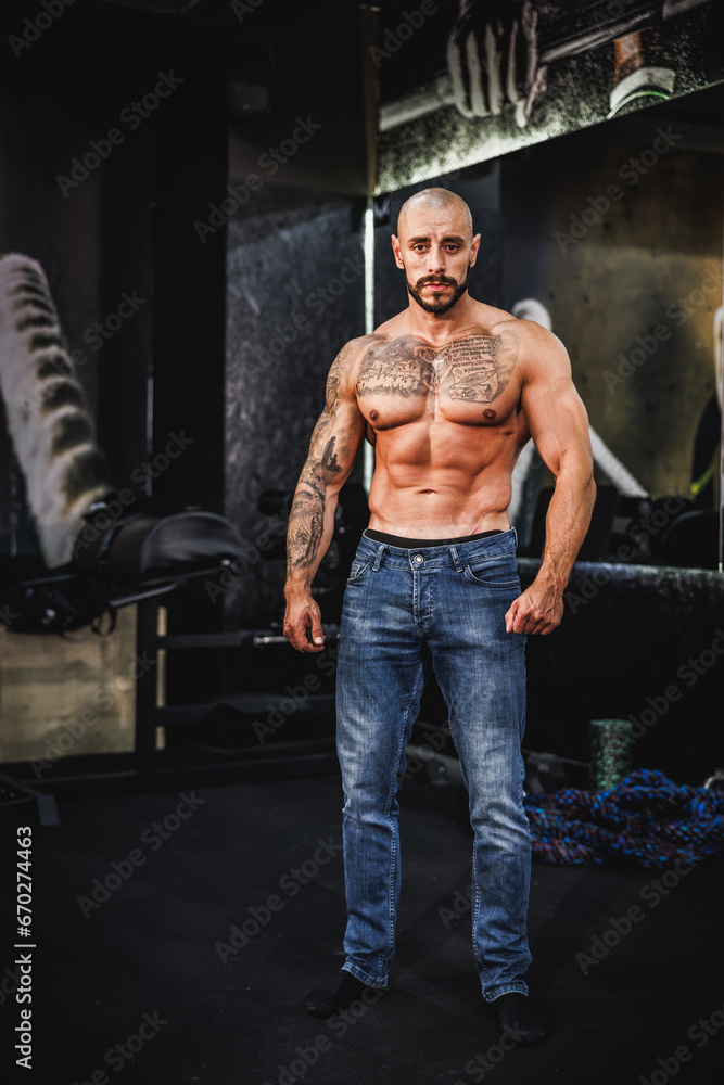 Fototapeta premium Bodybuilder Posing At The Gym