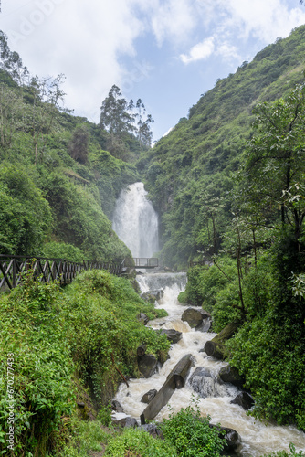 A picturesque waterfall in the forests of Ecuador on the outskirts of the city of Otavalo. © nikwaller