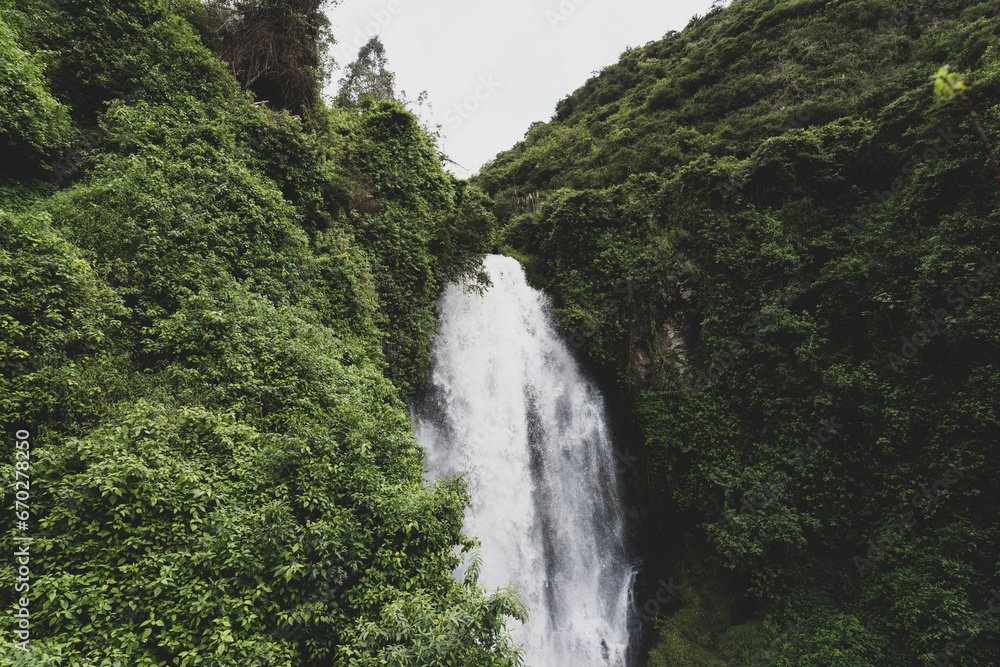 A picturesque waterfall in the forests of Ecuador on the outskirts of the city of Otavalo. A picturesque waterfall in the forests of Ecuador on the outskirts of the city of Otavalo.